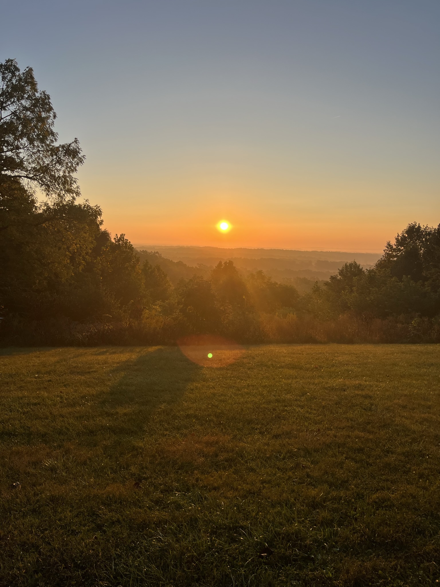 Warm sunset light over a fall garden landscape in Brown County.